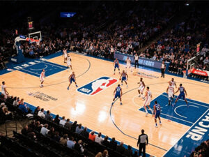 Referees in NBA basketball games wear referee earpieces while working