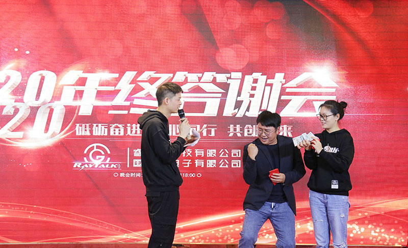 Two RayTalk employees came on stage to participate in the game