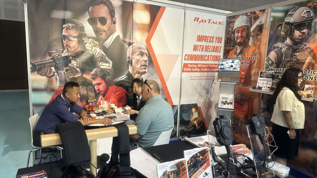 Visitors consulting with the RayTalk team at the booth during CCW Dubai